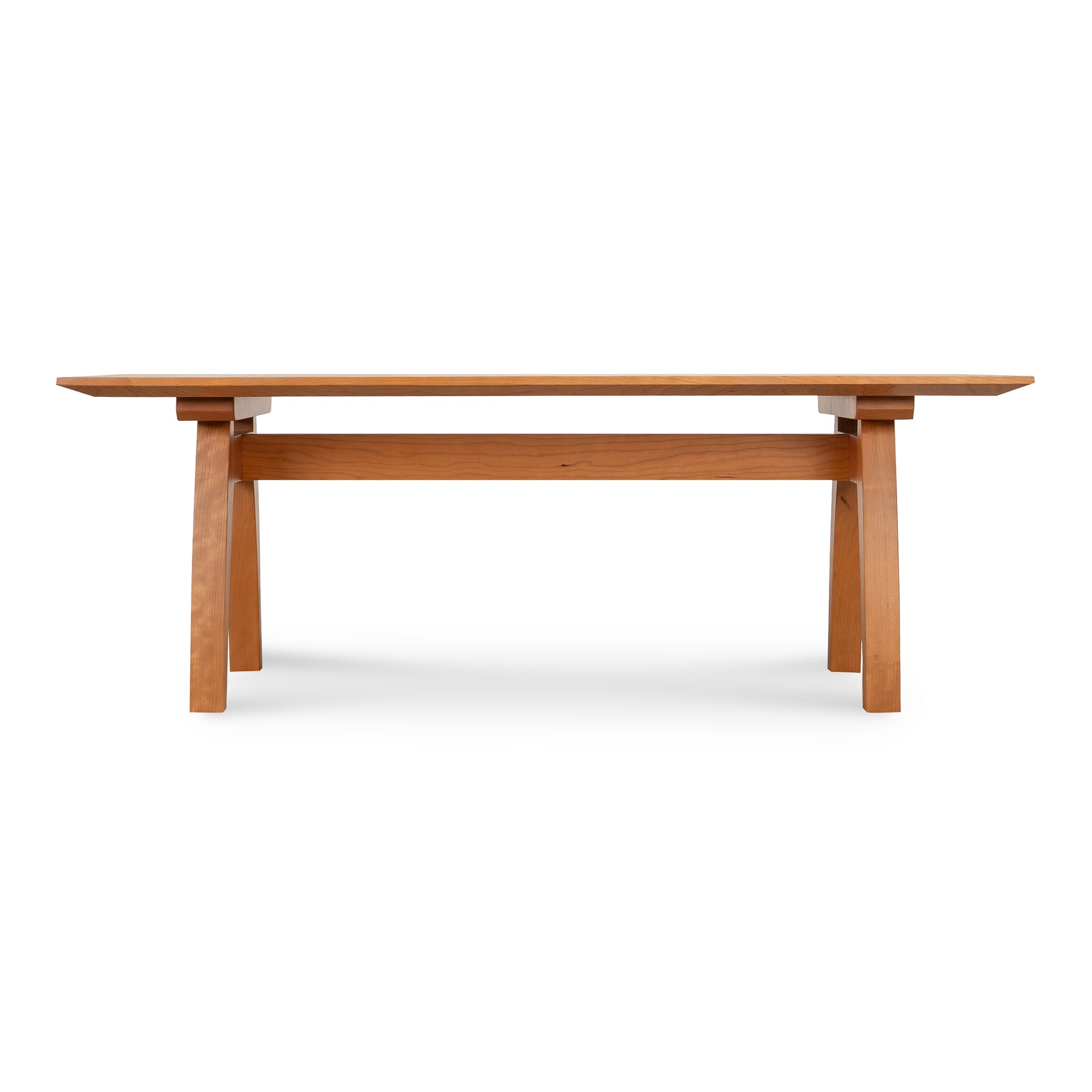 Minimalist Vermont Modern Trestle Coffee Table with rectangular top and angled legs, crafted from sustainably sourced solid wood by Lyndon Furniture.