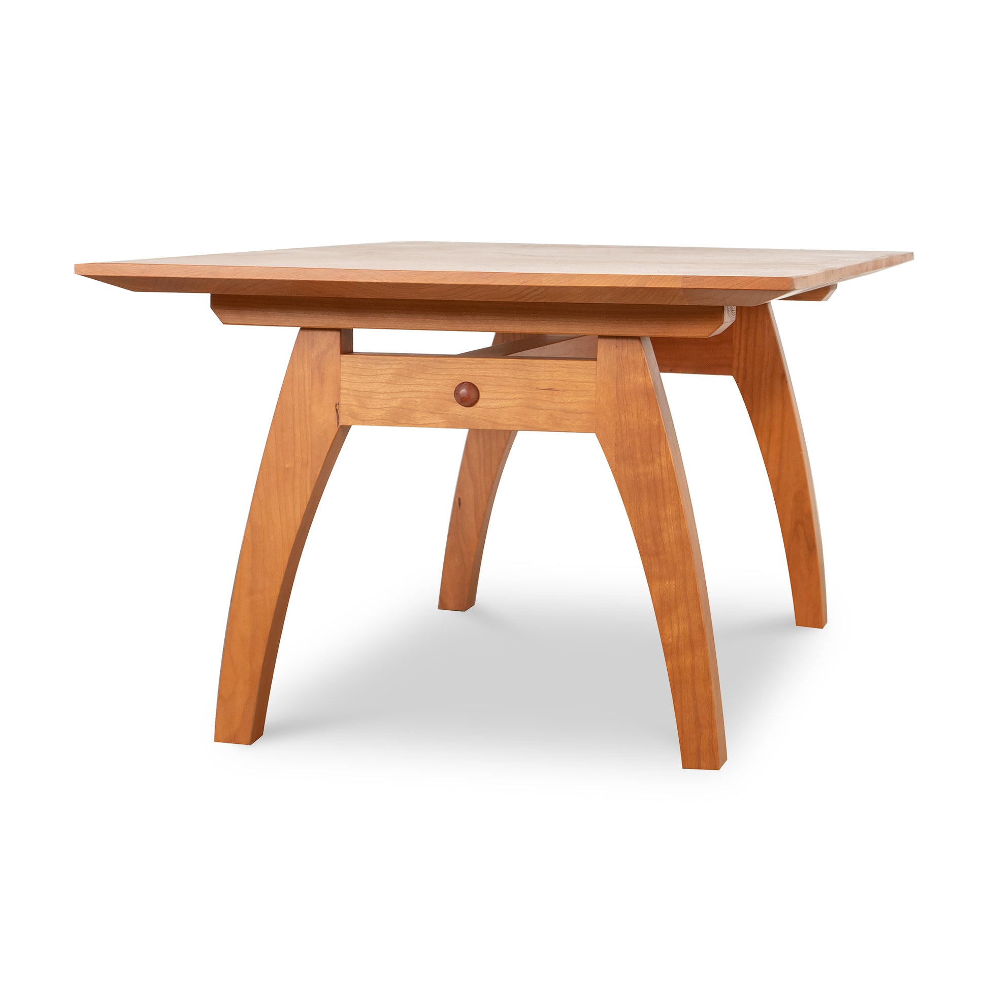 Square-top Vermont Modern Trestle Coffee Table by Lyndon Furniture with gracefully curved legs, crafted from sustainably harvested solid wood.