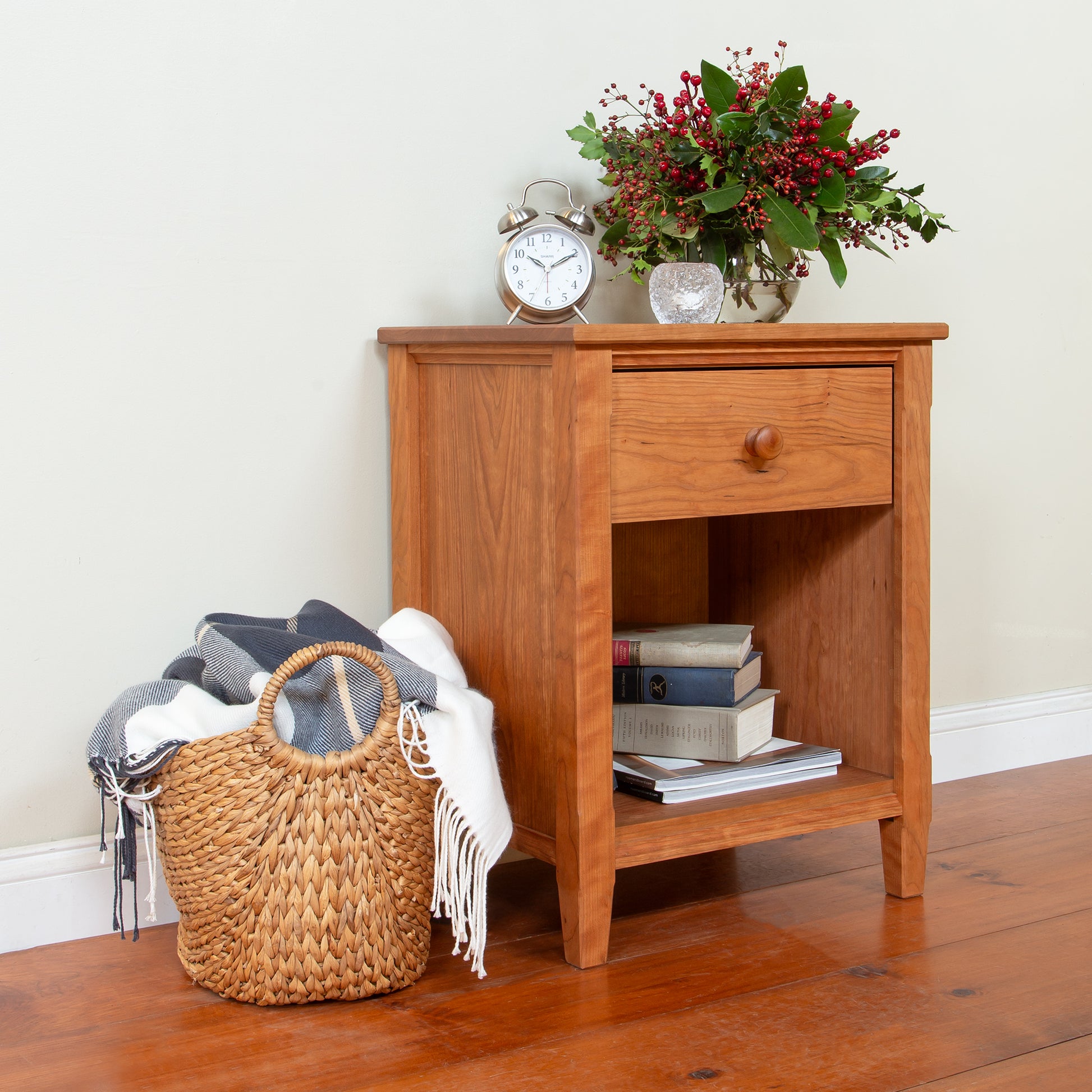 Vermont Shaker 1-Drawer Nightstand in cherry by Maple Corner Woodworks, with subtle decor on top, expertly crafted American made bedroom furniture.