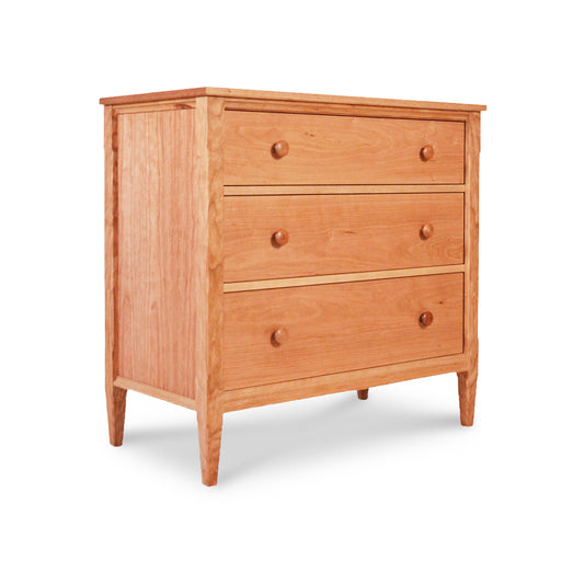 The Vermont Shaker 3-Drawer Chest, crafted from sustainably harvested wood, is showcased on a white background.