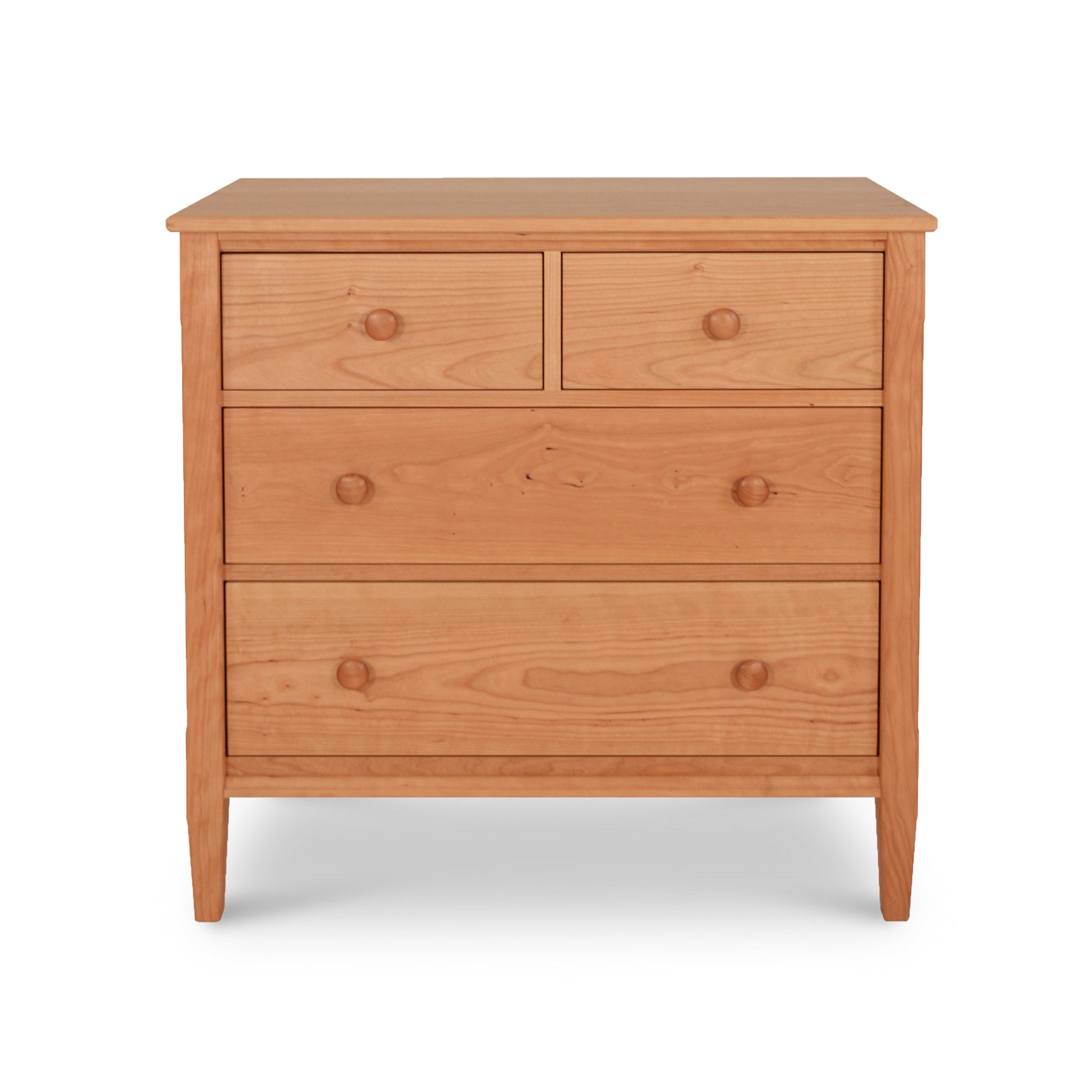 A Maple Corner Woodworks Vermont Shaker 4-drawer chest, handmade from wood, on a white background.