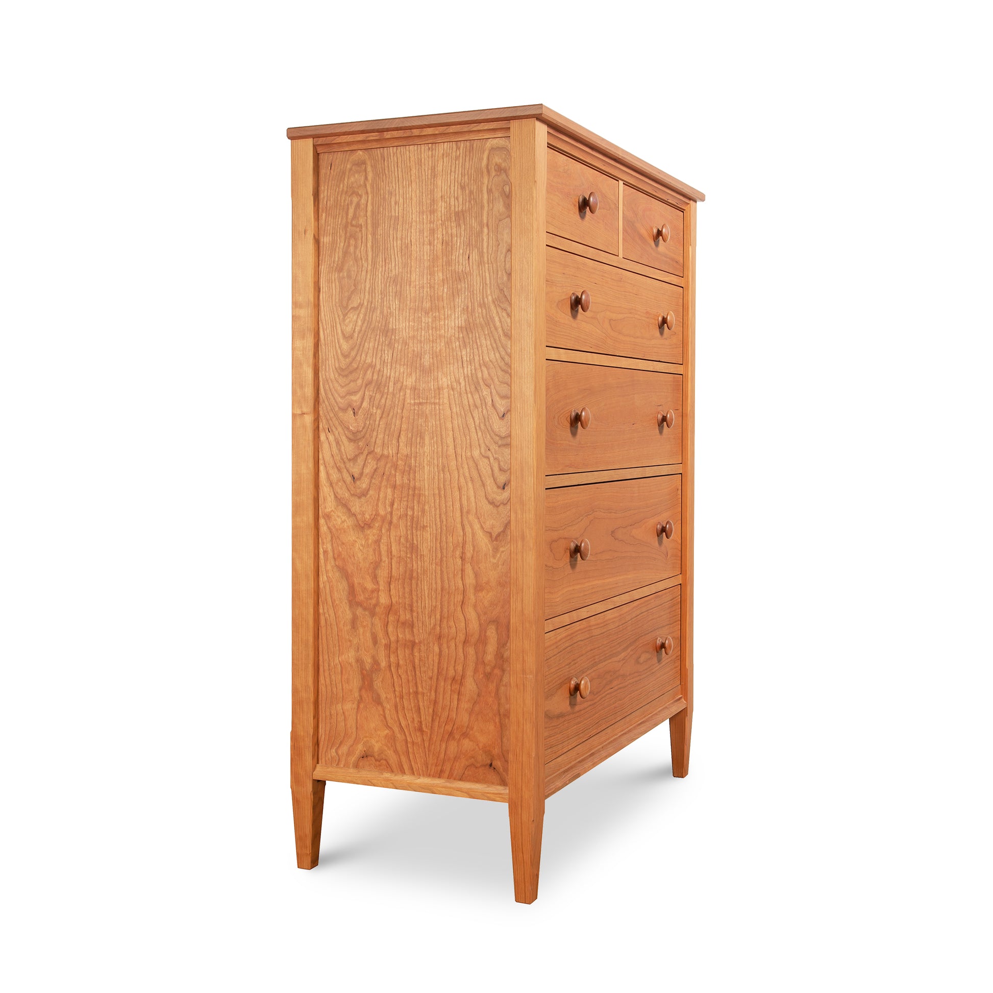 Vermont Shaker 6-Drawer Chest by Maple Corner Woodworks showcasing handcrafted hardwood, sleek tapered legs, six elegantly designed handles, and a natural finish.