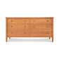 Vermont Shaker 6-Drawer Dresser by Maple Corner Woodworks with round knobs, solid wood construction, natural finish, and four tapered legs.