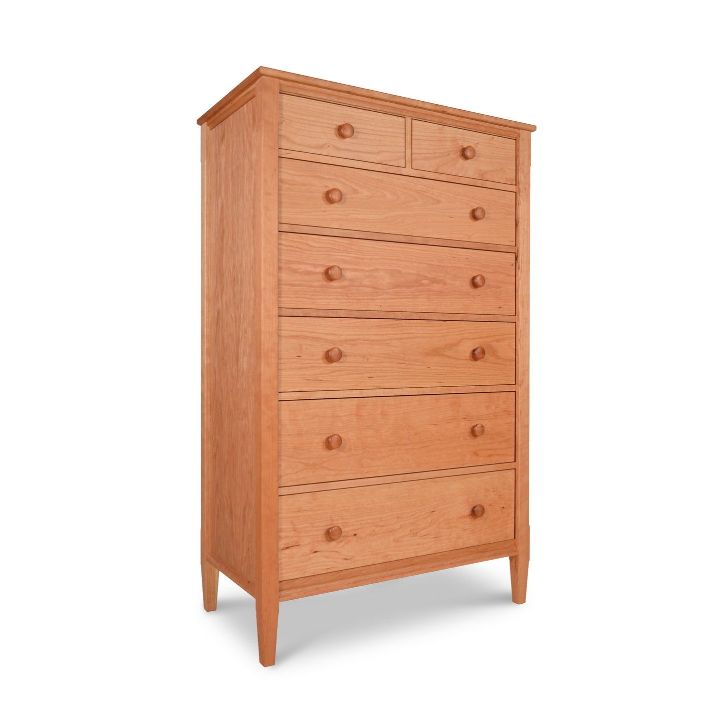 A Maple Corner Woodworks Vermont Shaker 7-Drawer Chest, made by skilled Vermont furniture makers, crafted from natural cherry wood, on a white background.
