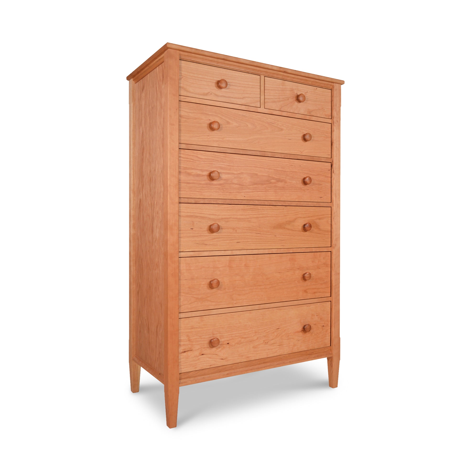 A natural cherry Maple Corner Woodworks Vermont Shaker 7 Drawer Chest on a white background.