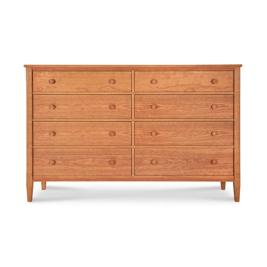 A Vermont Shaker 8-Drawer Dresser by Maple Corner Woodworks, featuring a simple design with round handles, set against a plain white background. This piece is crafted from solid hardwoods.
