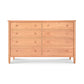 A Maple Corner Woodworks Vermont Shaker 8-Drawer Dresser, crafted from solid hardwoods, featuring round knobs and standing against a white background.