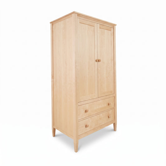 Maple Corner Woodworks Vermont Shaker Armoire features 2 doors, 2 drawers, and 4 legs in classic Shaker style, crafted from solid wood.