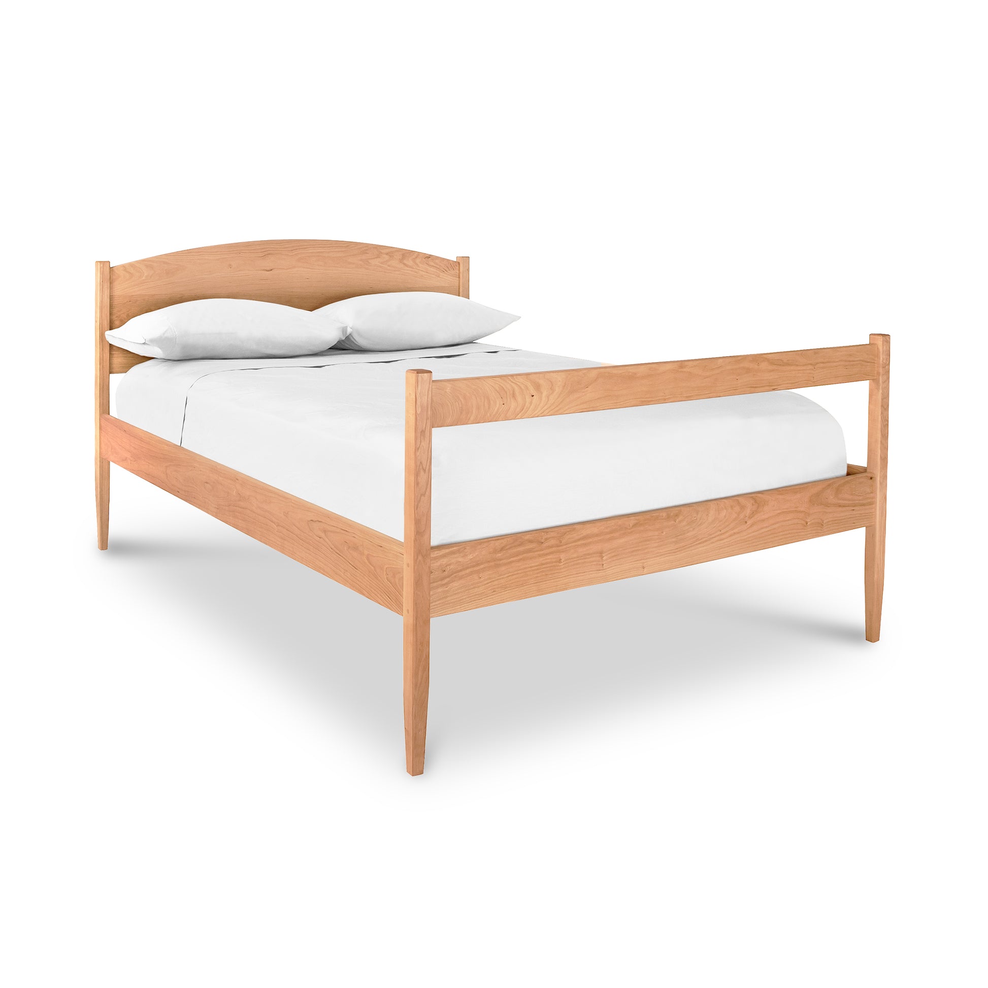 Vermont Shaker Bed by Maple Corner Woodworks with curved headboard and natural finish, featuring optional underbed storage.