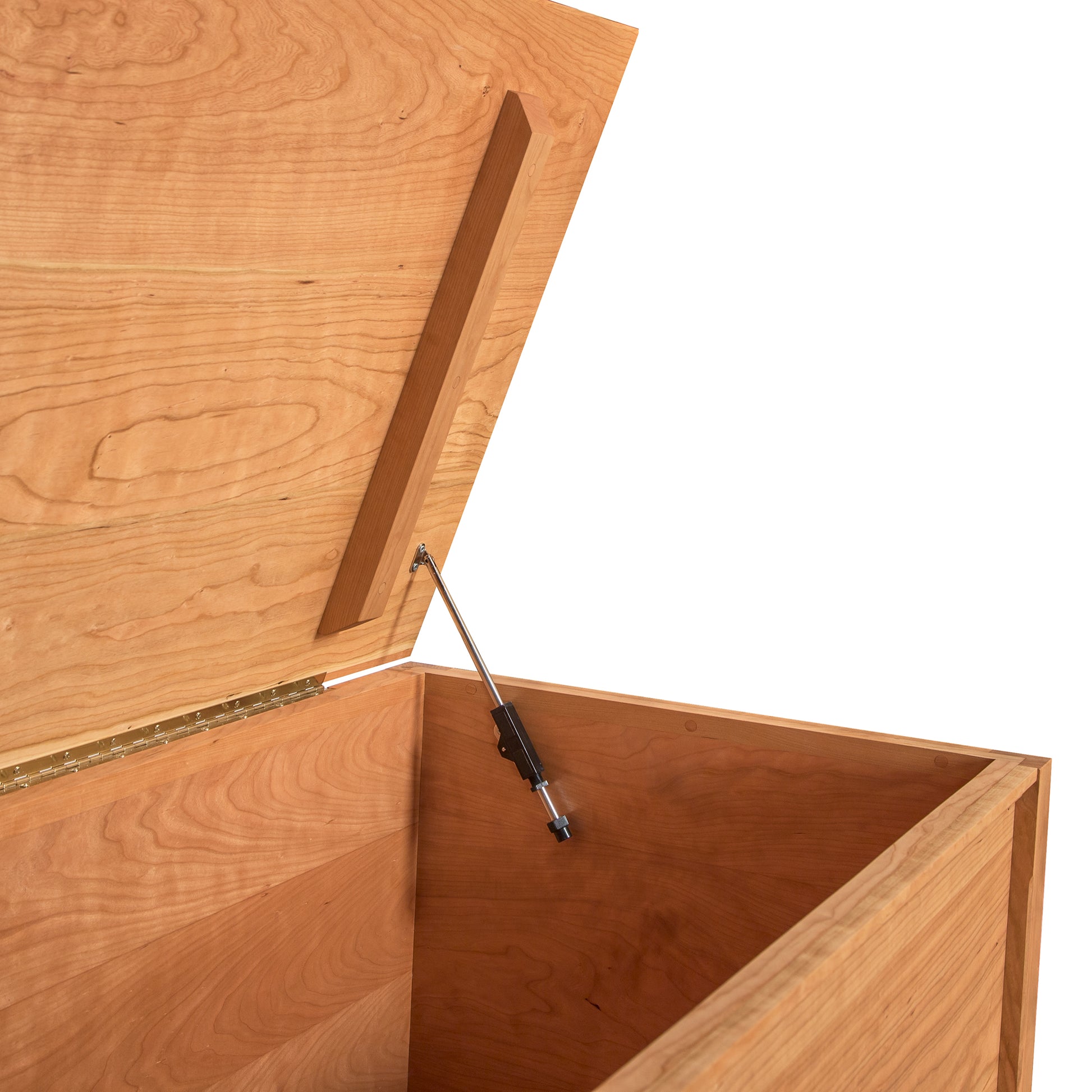 An open Maple Corner Woodworks Vermont Shaker Blanket Chest with a lifted hinged lid, held open by a metal support, set against a white background. The inside of the chest appears spacious and empty.