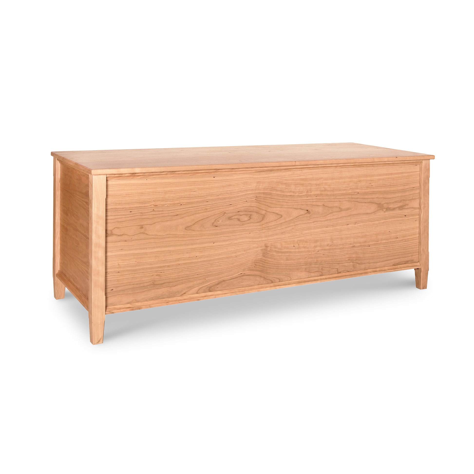 A Vermont Shaker Blanket Chest by Maple Corner Woodworks with a smooth finish and simple, clean lines, positioned against a white background. This eco-friendly chest features a hinged lid and slightly tapered legs.