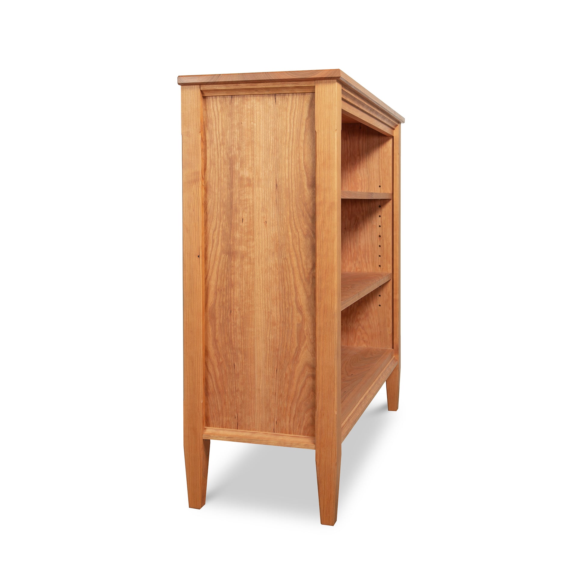 Vermont Shaker Bookcase by Maple Corner Woodworks with four shelves and elegantly tapered legs, crafted from sustainably harvested hardwoods; part of the Vermont Shaker Furniture Collection.