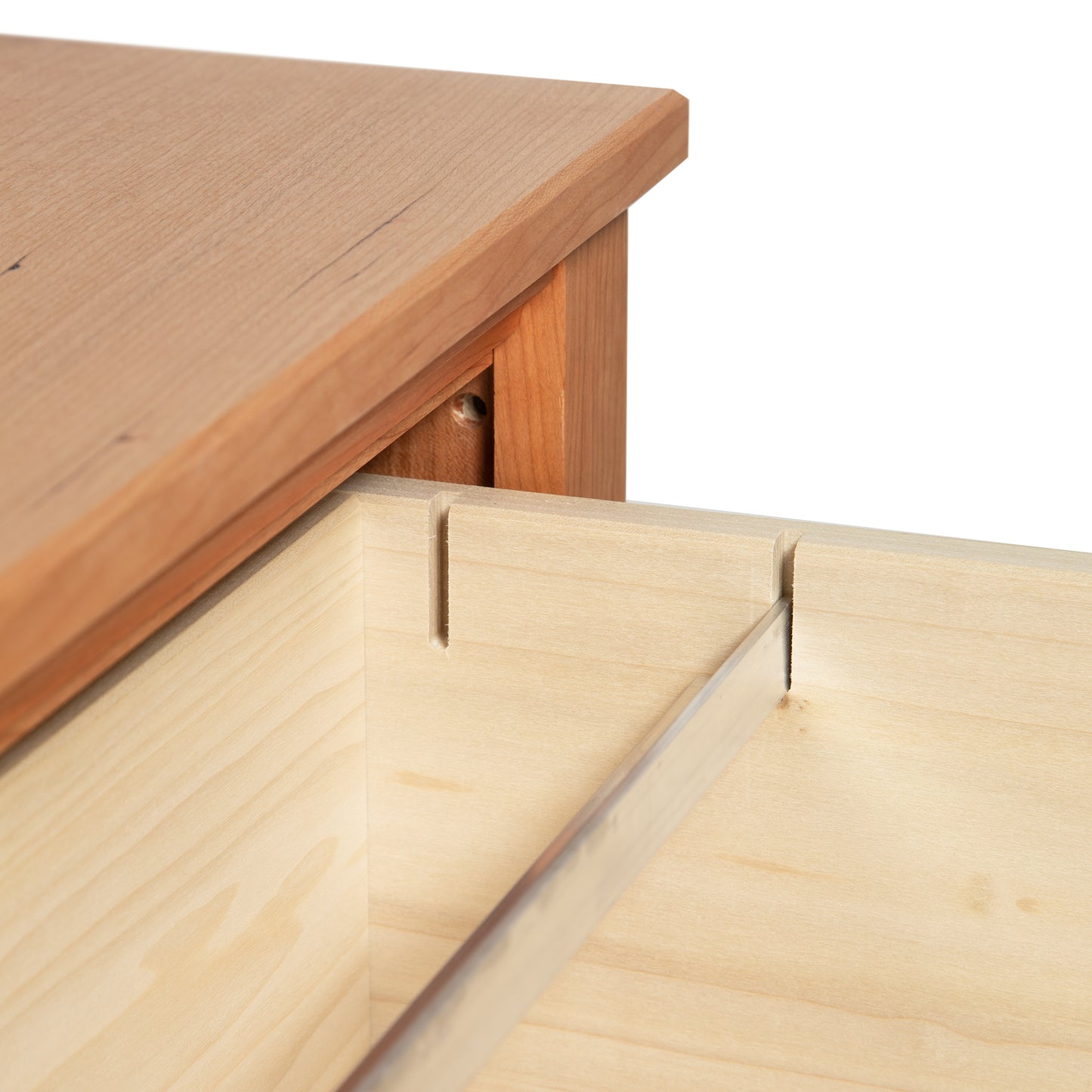 Vermont Shaker 2-Drawer Lateral File Cabinet by Maple Corner Woodworks, featuring a close-up of its partially opened drawer and dovetail joint.