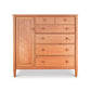 A Maple Corner Woodworks Vermont Shaker Gent's Chest, handcrafted wooden dresser with a single cabinet door and six drawers, each fitted with a round knob, standing against a plain white background.