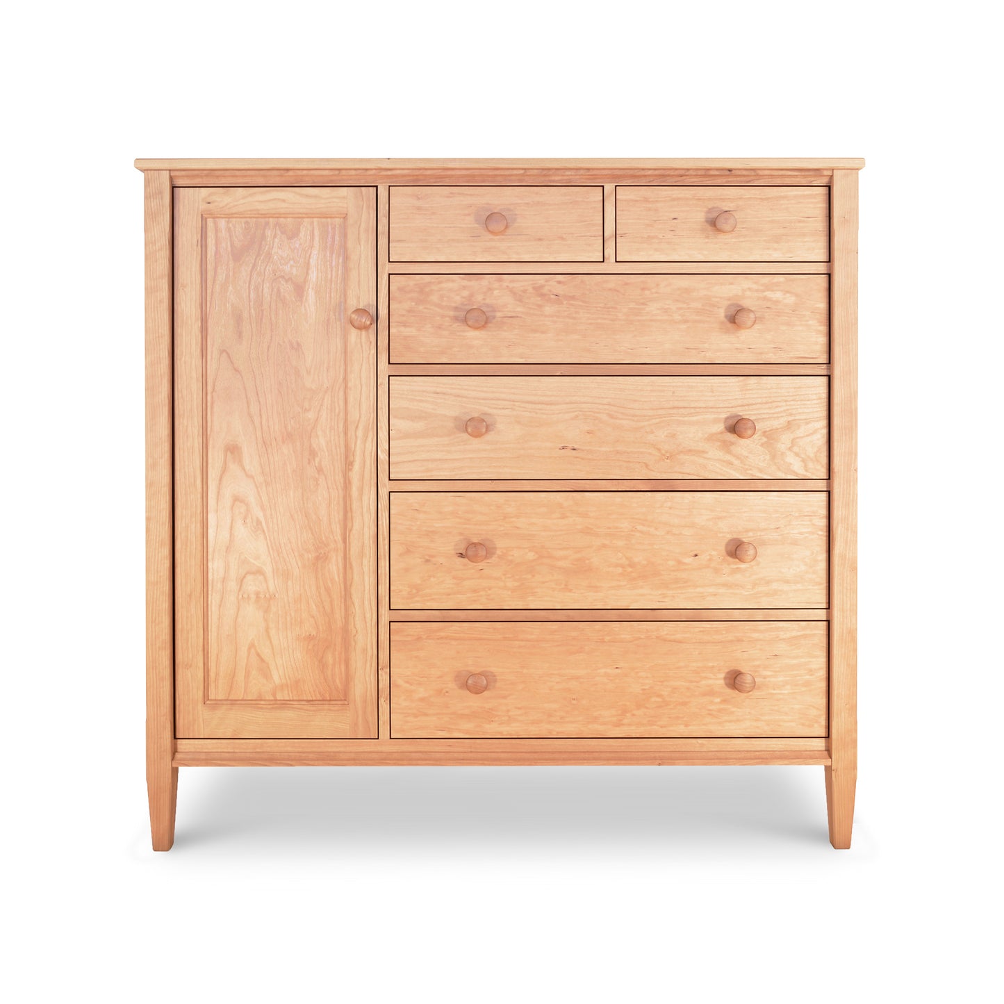 A Vermont Shaker Gent's Chest by Maple Corner Woodworks with one tall cabinet door on the left and five drawers of varying sizes on the right, all with round knobs, against a white background.
