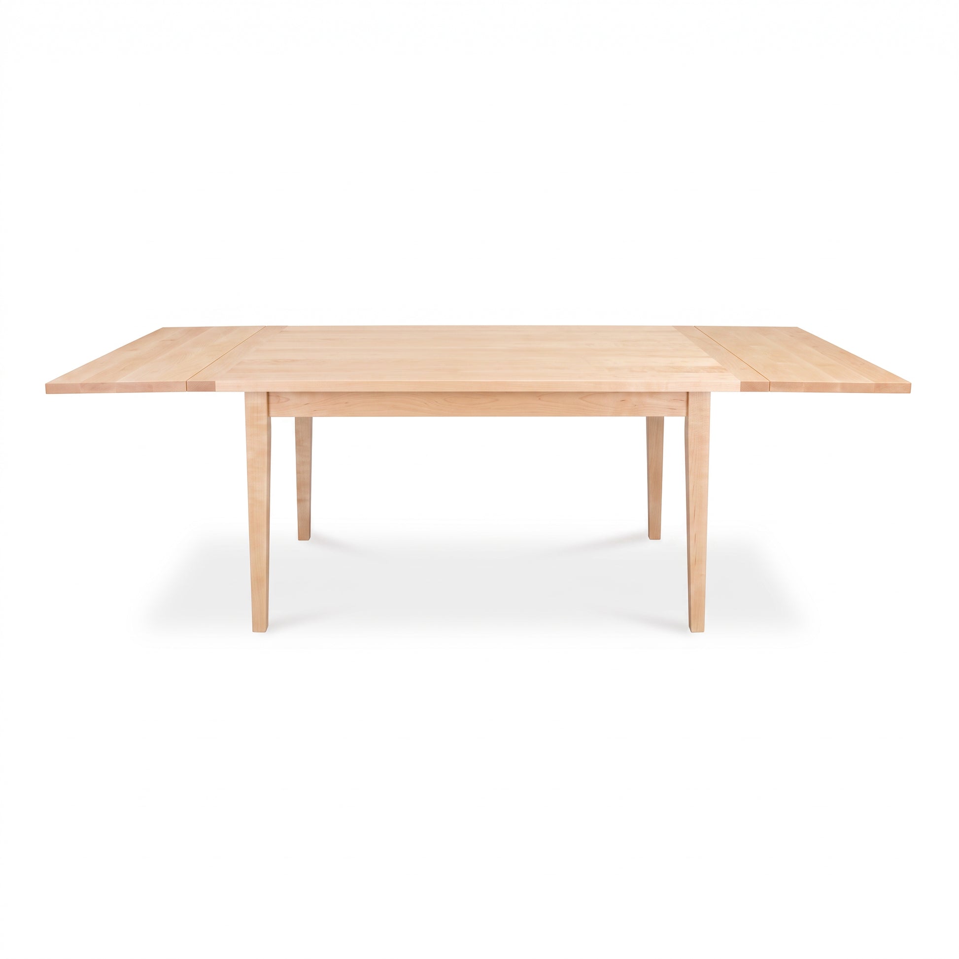 Rectangular Vermont Shaker Harvest Extension Dining Table by Maple Corner Woodworks in a light finish, showcasing handcrafted American craftsmanship.