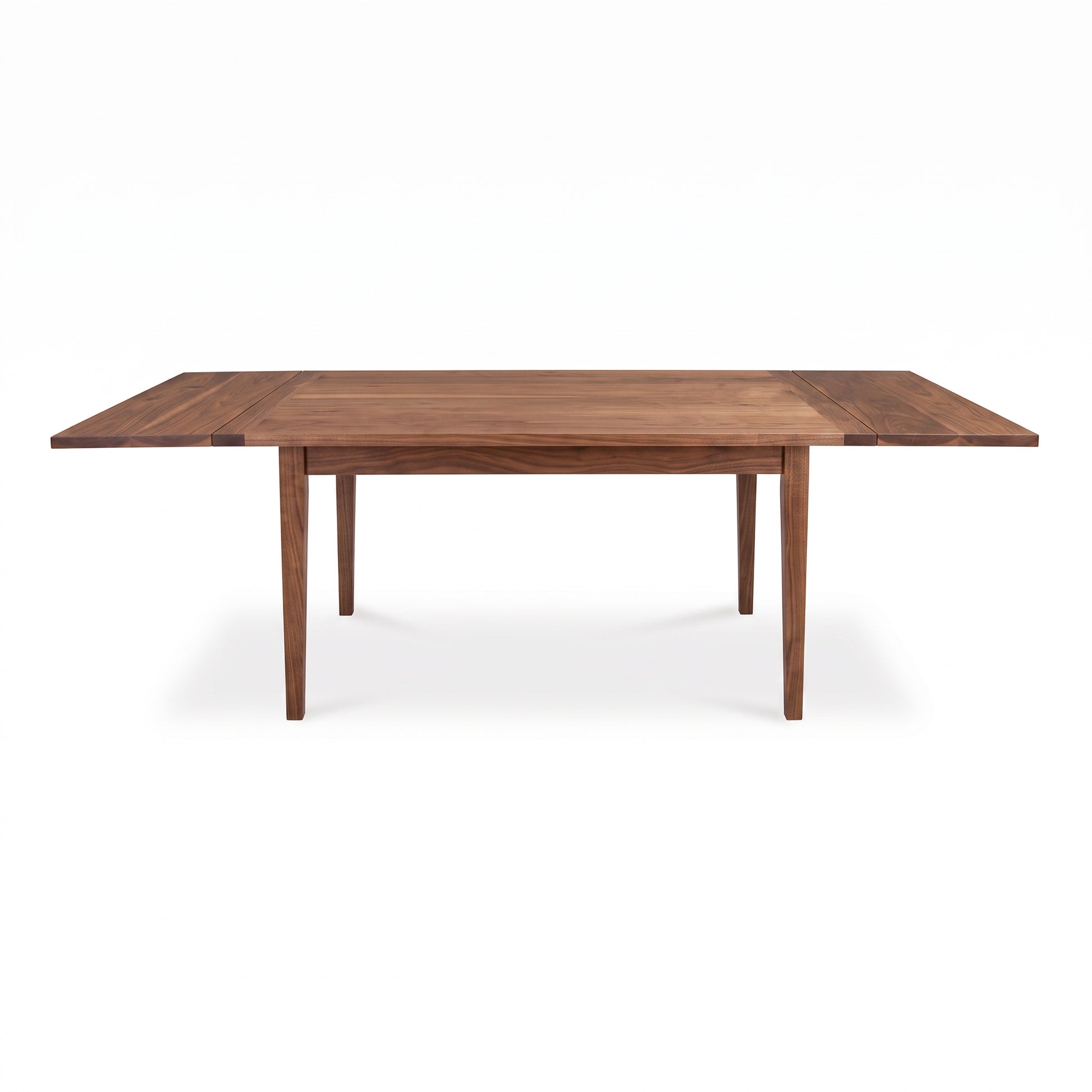 Vermont Shaker Harvest Extension Dining Table by Maple Corner Woodworks with four legs and extension leaves highlighted against a plain background.