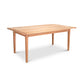 A simple rectangular extension table made of natural cherry wood with four legs, isolated on a white background. The Vermont Shaker Solid Top Harvest Table by Maple Corner Woodworks shows a natural wood finish with visible grain patterns.