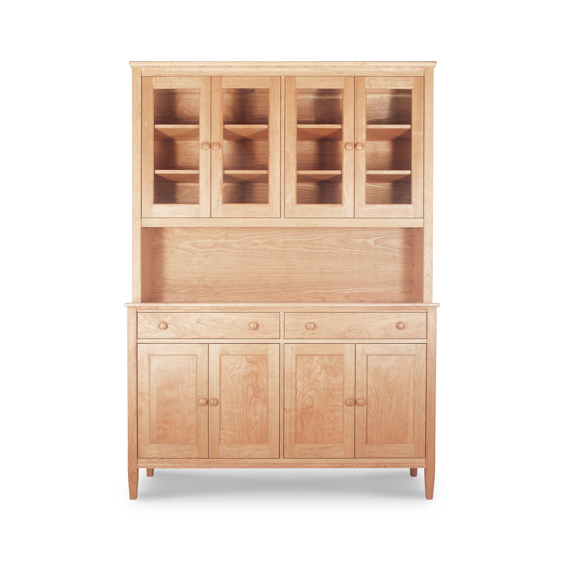 Solid natural cherry Maple Corner Woodworks Vermont Shaker Large China Cabinet with upper adjustable shelves and lower cabinets and drawers, isolated on a white background.