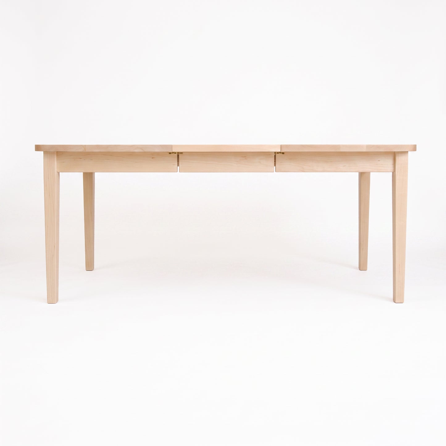 Vermont Shaker Oval Extension Dining Table by Maple Corner Woodworks, featuring four legs and elegant craftsmanship in solid wood.