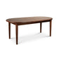 Vermont Shaker Oval Extension Dining Table by Maple Corner Woodworks, showing its smooth hardwood top and four straight legs.