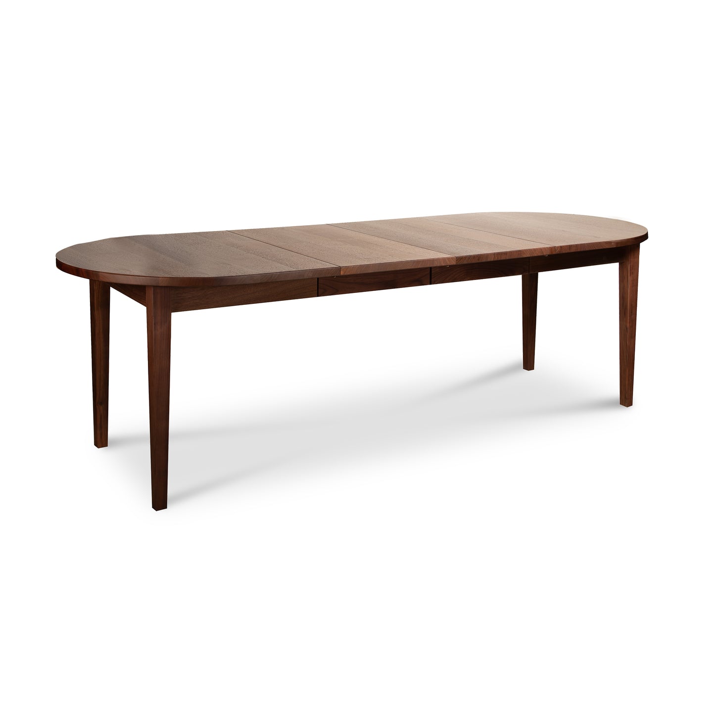 Vermont Shaker Oval Extension Dining Table by Maple Corner Woodworks with four straight legs and a sleek dark brown wood finish.