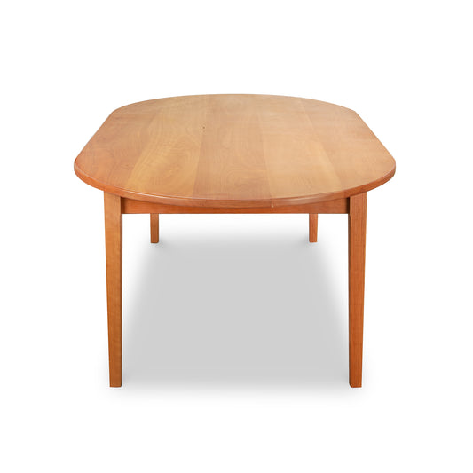 Vermont Shaker Oval Solid Top Dining Table by Maple Corner Woodworks in natural finish, featuring an elegant oval top and sturdy four-leg design.