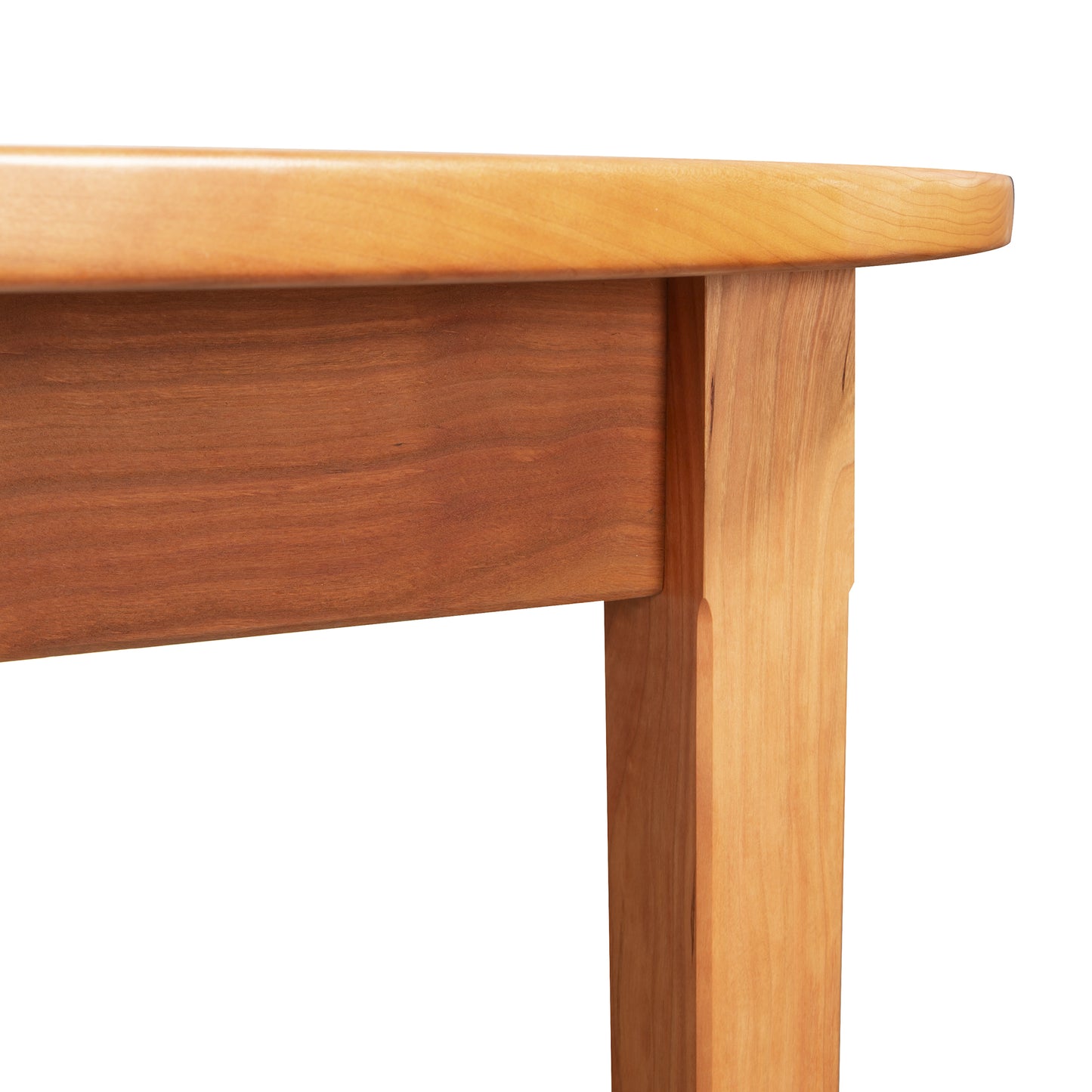 Vermont Shaker Oval Solid Top Dining Table by Maple Corner Woodworks featuring solid hardwood legs and handcrafted corner joinery details.
