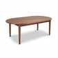 Vermont Shaker Oval Solid Top Dining Table by Maple Corner Woodworks featuring a wooden oval top and four straight legs.