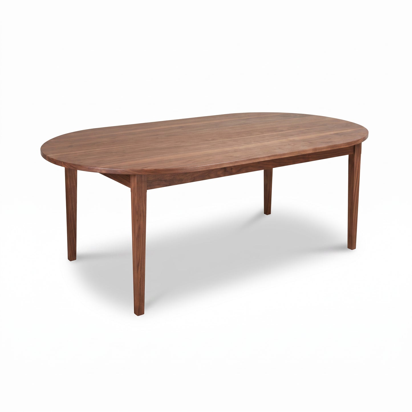 Vermont Shaker Oval Solid Top Dining Table by Maple Corner Woodworks featuring a wooden oval top and four straight legs.