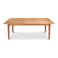 A Vermont Shaker Rectangular Extension Dining Table made from sustainably harvested wood, with extendable leaves on each end, standing on four legs, isolated against a white background. - Maple Corner Woodworks