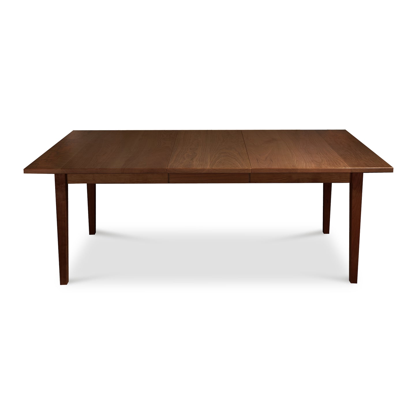 A handcrafted Maple Corner Woodworks Vermont Shaker Rectangular Extension Dining Table made of solid wood with two drawers.