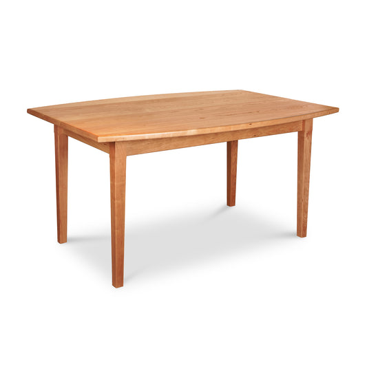 Maple Corner Woodworks Vermont Shaker boat-shaped solid wood dining table with a rectangular top and tapered legs.