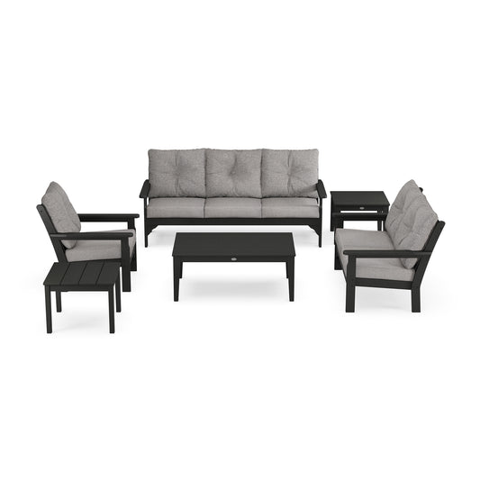 A modern POLYWOOD Vineyard 6-Piece Deep Seating Set including a sofa with cushions, two armchairs with cushions, a coffee table, and a side table, all made from weather-resistant recycled plastic lumber in dark