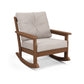 A modern POLYWOOD® Vineyard Deep Seating Rocking Chair with a brown frame and plush, light beige cushions on a white background.