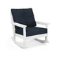 A white POLYWOOD Vineyard Deep Seating Rocking Chair with dark blue cushions on a plain white background.