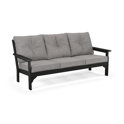 A three-seater cushioned POLYWOOD Vineyard Deep Seating Sofa with a dark frame and light gray upholstery, featuring button-tufted back cushions and made from weather-resistant recycled plastic, isolated on a white.