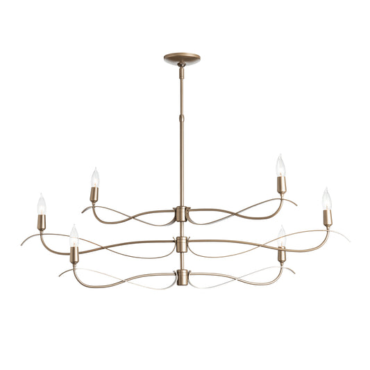 The Hubbardton Forge Willow 6-Light Small Chandelier, manufactured by the renowned brand name Hubbardton Forge, features a modern design with a brass finish, perfect for illuminating any space.
