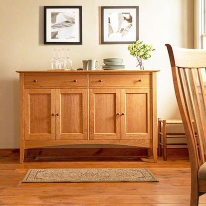 A wooden sideboard in a dining room.