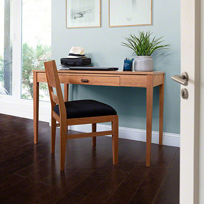 A room with a desk and chair.