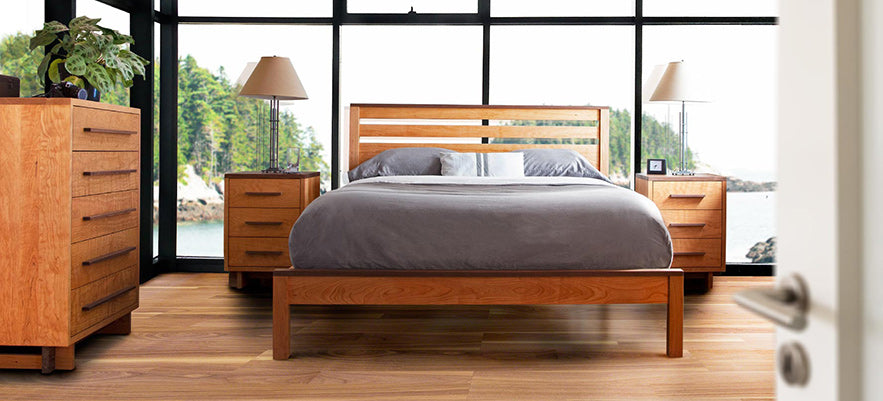 Wooden bed frame, matching nightstands, and dresser showcasing American craftsmanship.