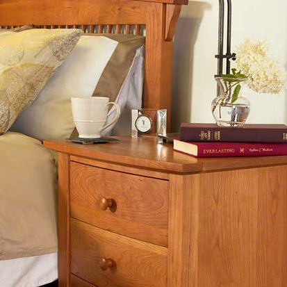 Two-drawer wooden nightstand showcasing craftsmanship and design excellence.