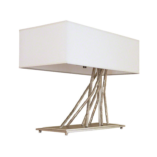 Brindille Table Lamp by Hubbardton Forge with sculpted branch-like metal rods and a white shade, showcasing elegant, artisan-crafted lighting design.