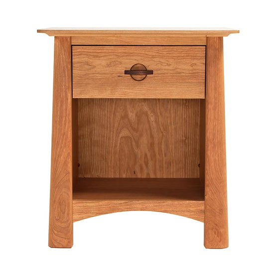 A small wooden nightstand with a drawer.