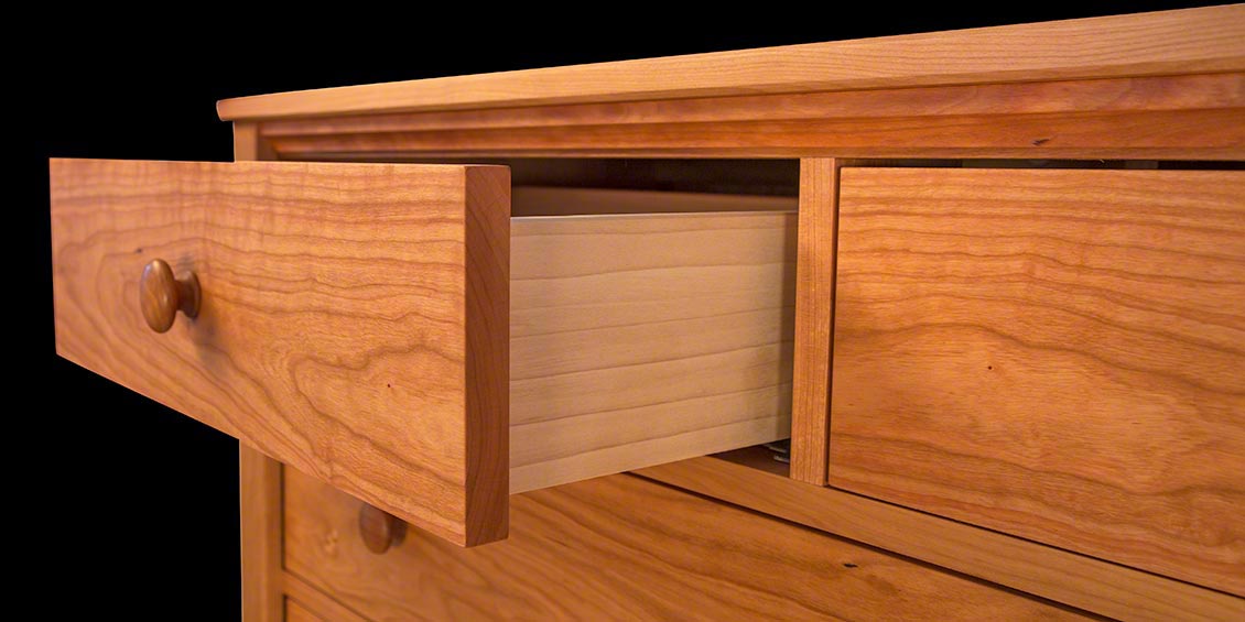 A drawer with a book inside of it.