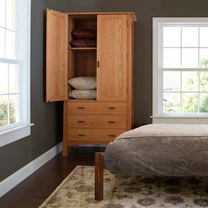 A bedroom with a bed and a dresser.