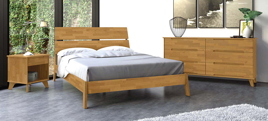 Wooden bed, nightstand, and dresser set on a gray floor.