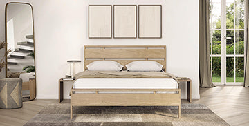 Wooden bed with two pillows and a bedside lamp, featuring a modern design.