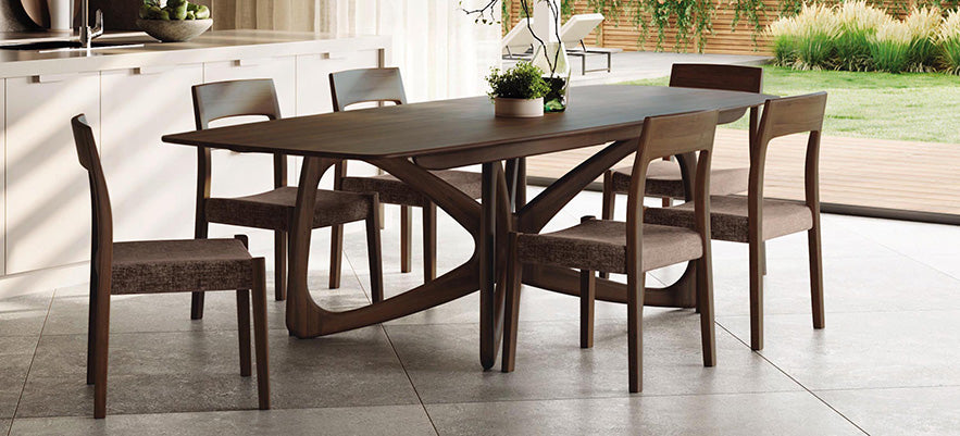 Elegant wooden dining table with six chairs.