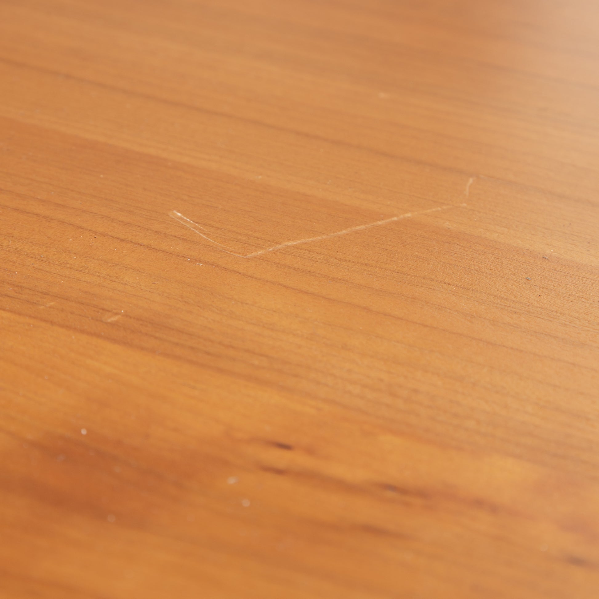 Lyndon Furniture Custom Modern Designer Bench in natural brown finish, showing a minor scratch on the surface. High-quality, American-made wood craftsmanship.